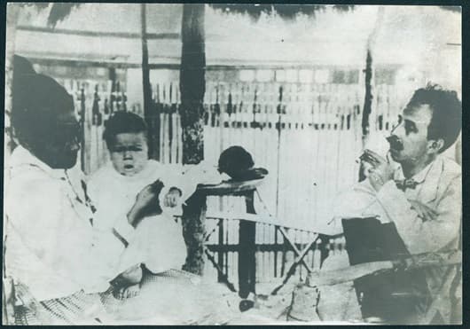 Archival Fiocruz photograph showing Carlos Chagas, seated at right, in a clinical setting.